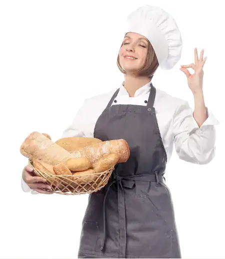 Happy baker holding a basket of fresh bread at EbuyerBaker Bakery MarketPlace.