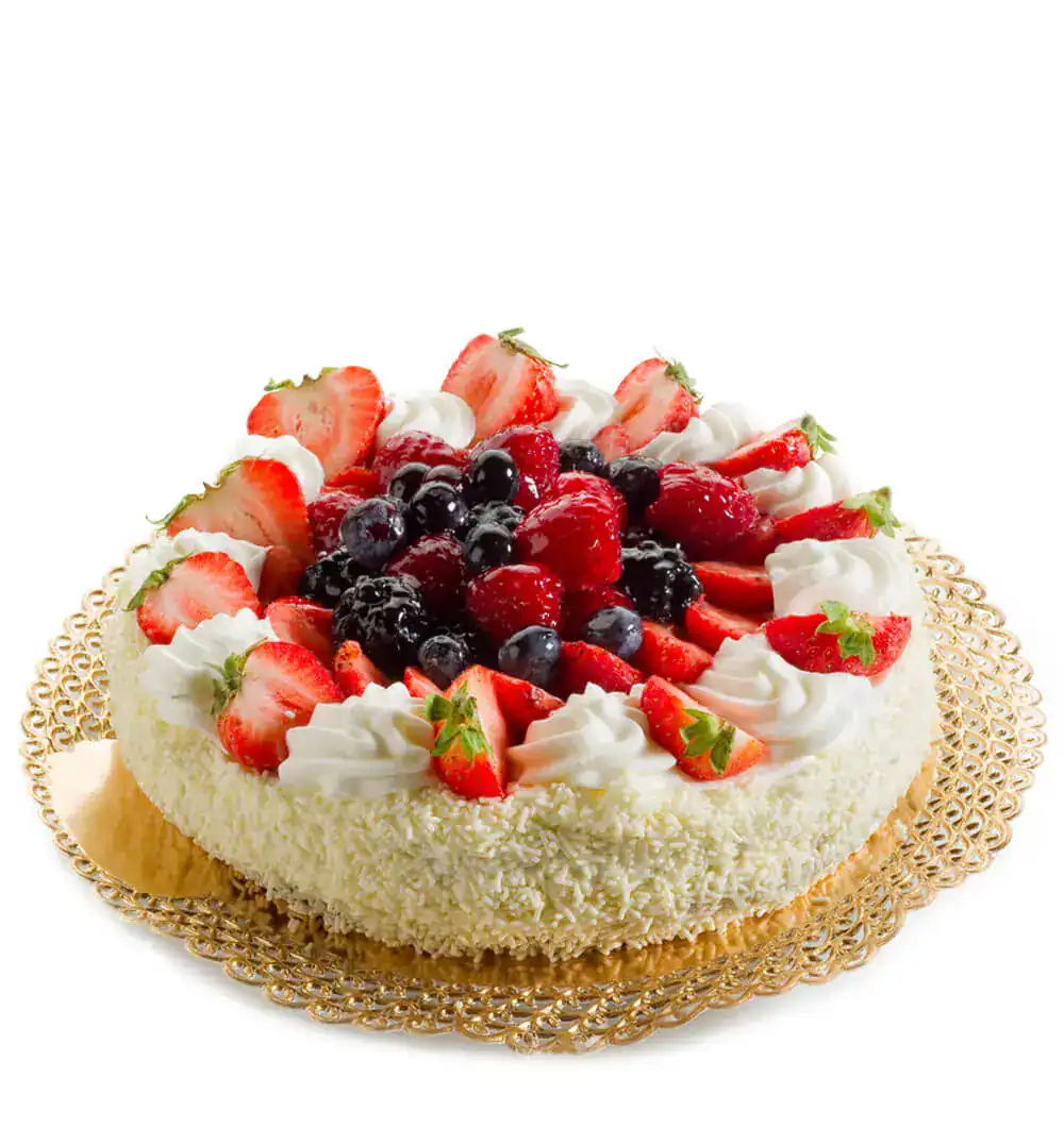 Delicious fruit cake with strawberries, blueberries, and cream topping.