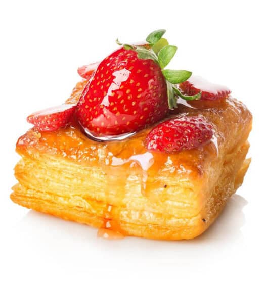 Delicious layered pastry with fresh strawberries and glaze.