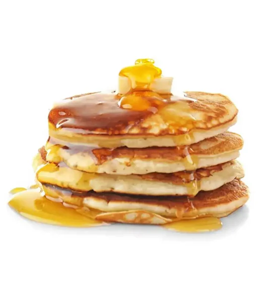 Stack of golden pancakes with syrup and butter.