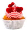 Delicious cupcake with pink frosting and heart-shaped toppings.